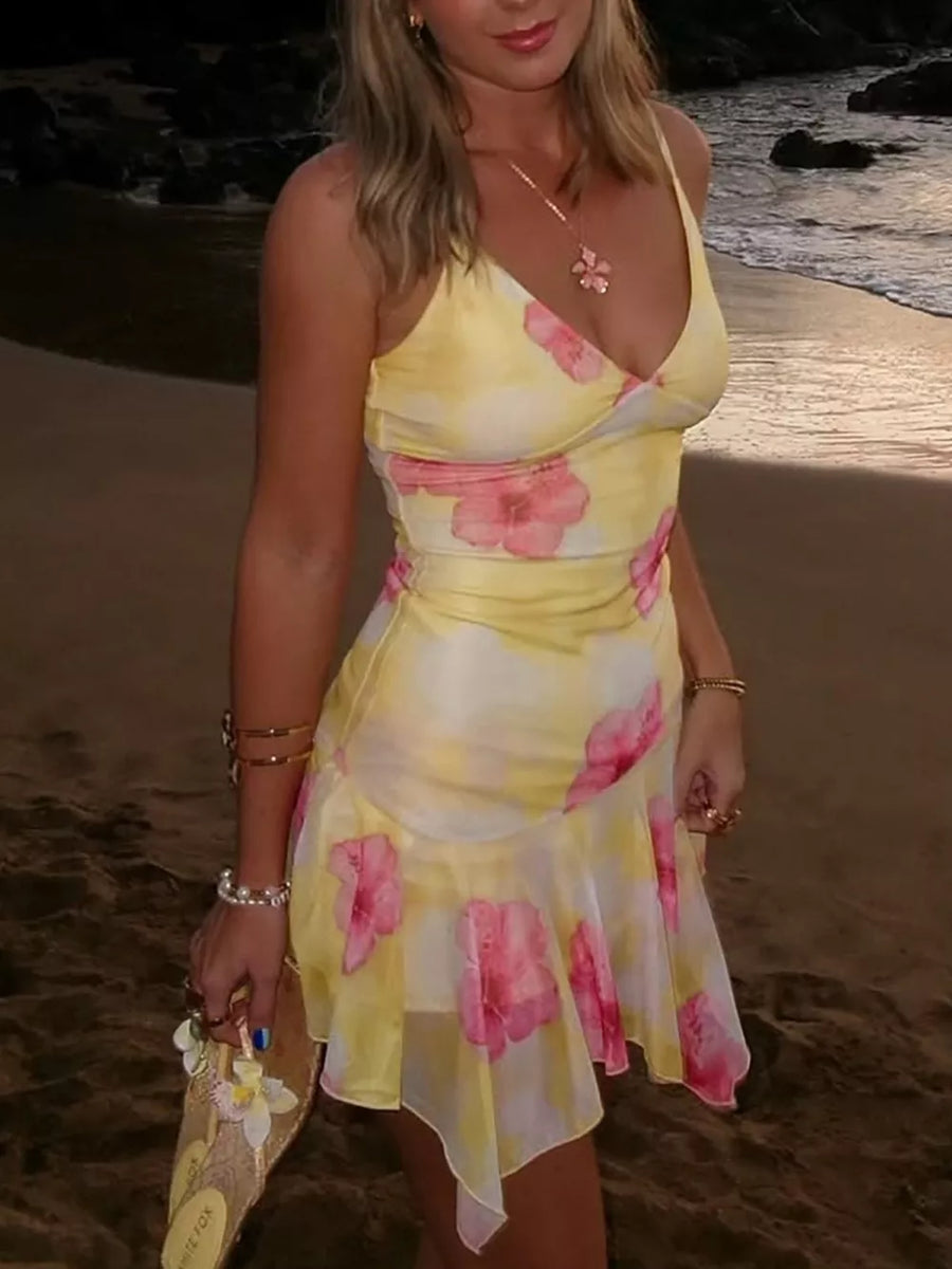 Yellow floral asymmetrical mini dress with ruffled hem and V-neck.