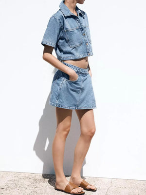Denim cropped button-up top and skort set in sky blue with contrast stitching.