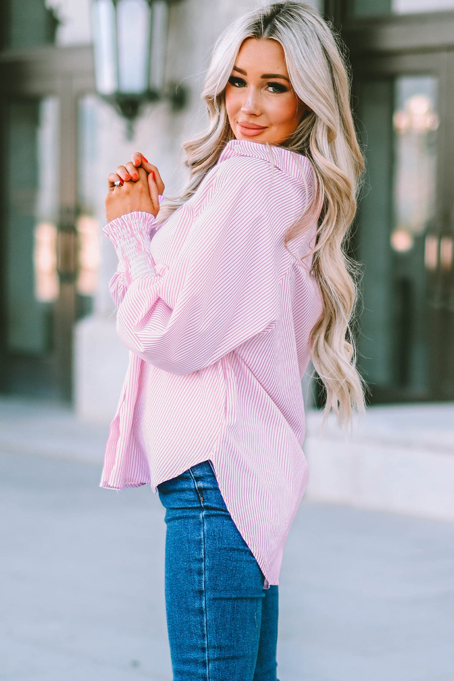 Blush pink pinstripe blouse with balloon sleeves and smocked cuffs.