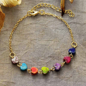 Gold chain bracelet with multicolor heart-shaped stones