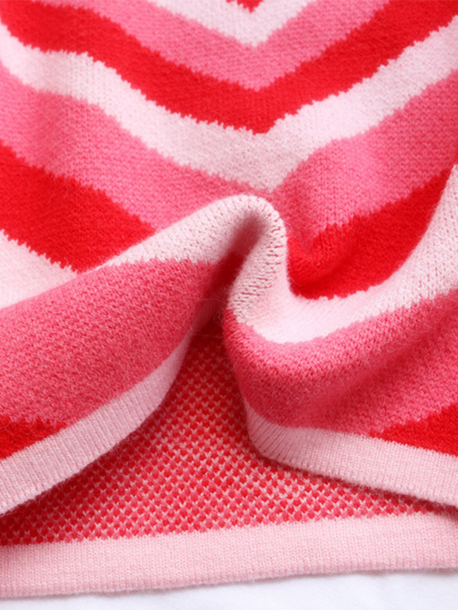 Heartbeat Stripe Mock Neck Knit sweater in pink and red chevron stripes.