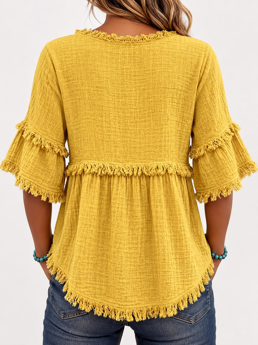 blouse in sky blue with fringe and hip-length