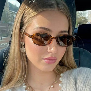 PC Frame material: Polycarbonate Lens material: Polycarbonate Temple material: P sunglasses in Camel with oval silhouette