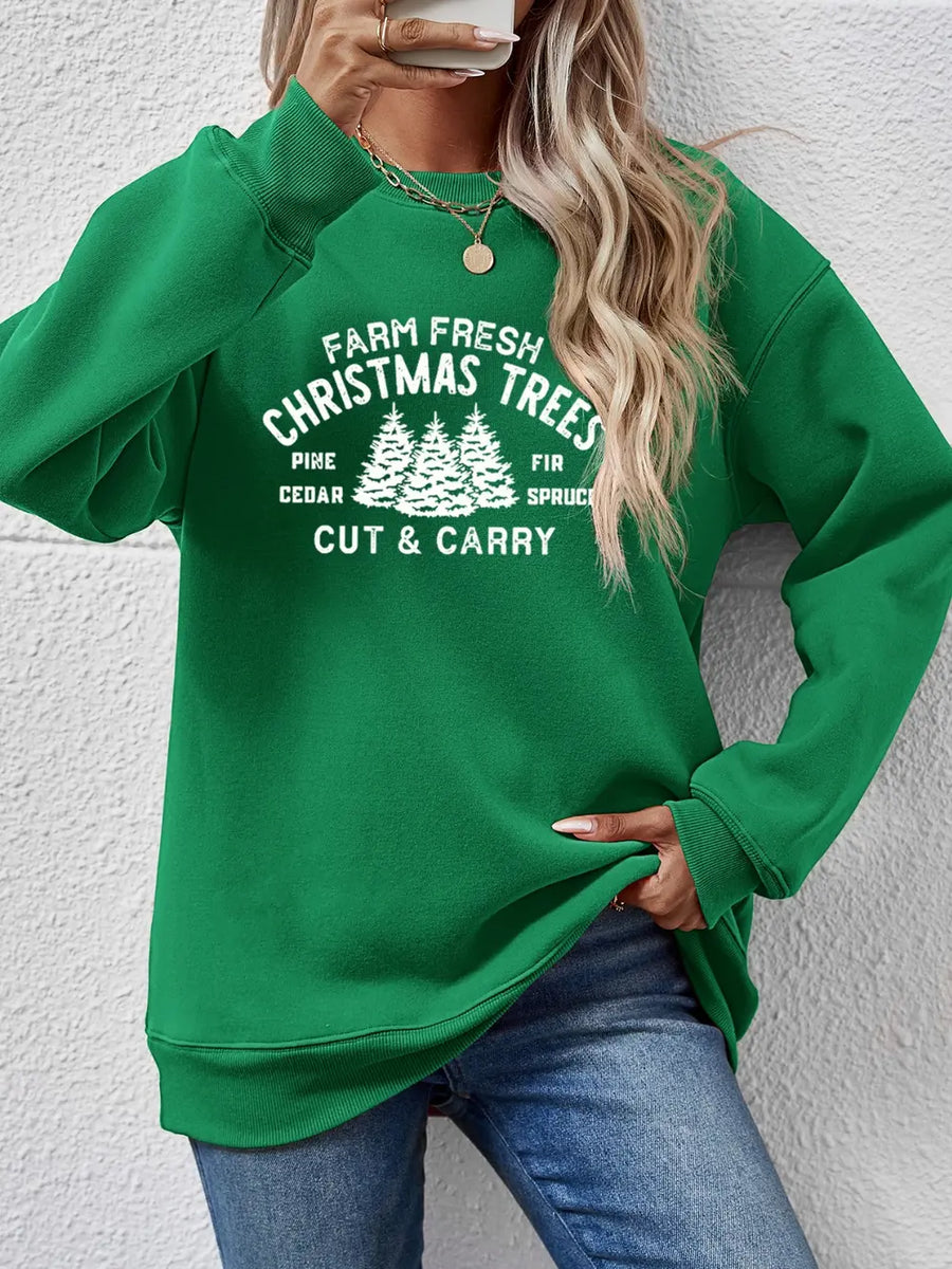 Green crewneck sweatshirt with "Farm Fresh Christmas Trees" graphic print