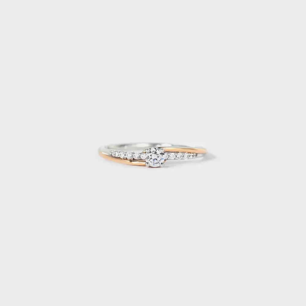 Silver dual band ring with diamond accents and a central stone.