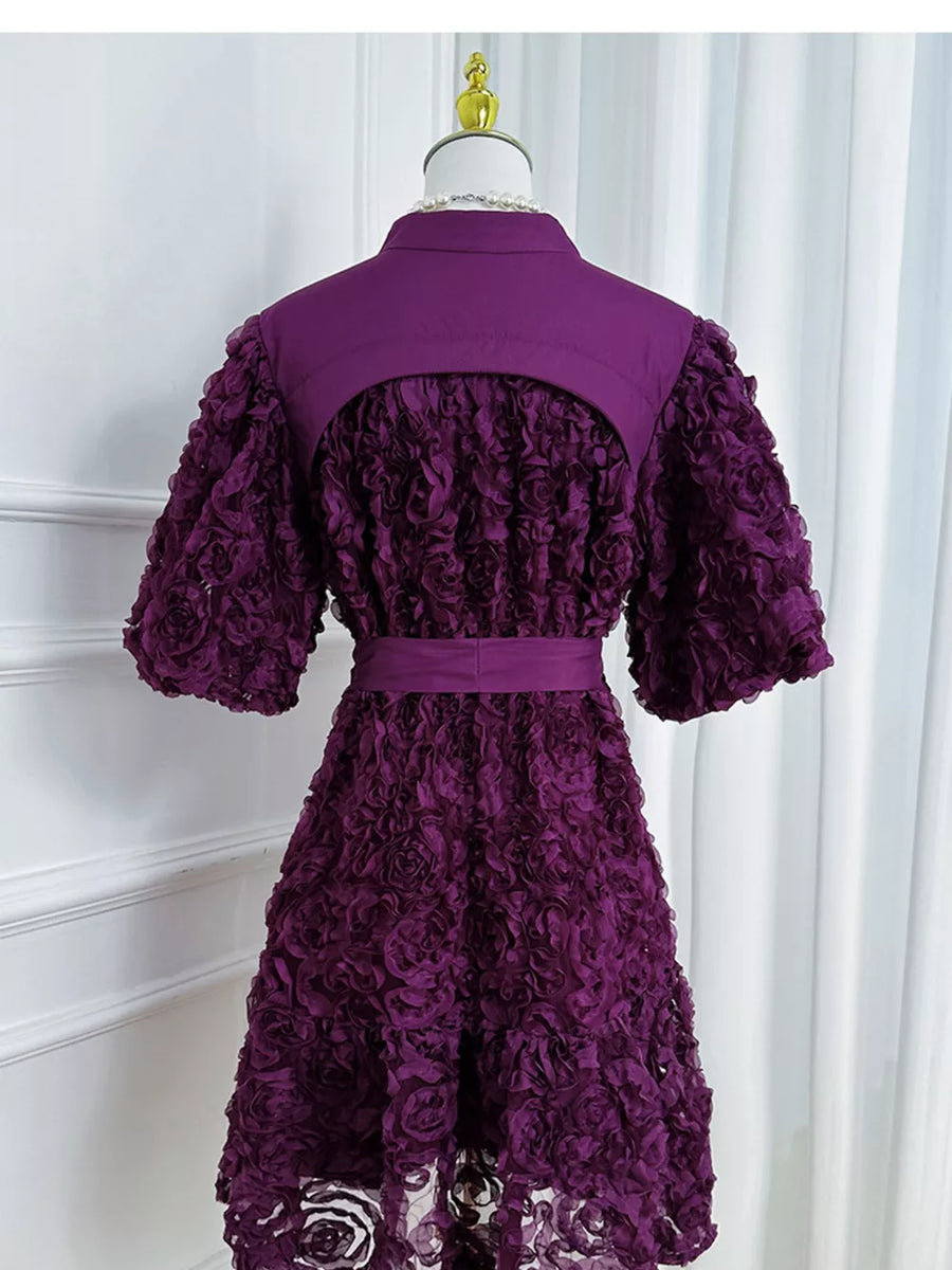 Purple floral textured puff sleeve dress with button detail and belted waist.