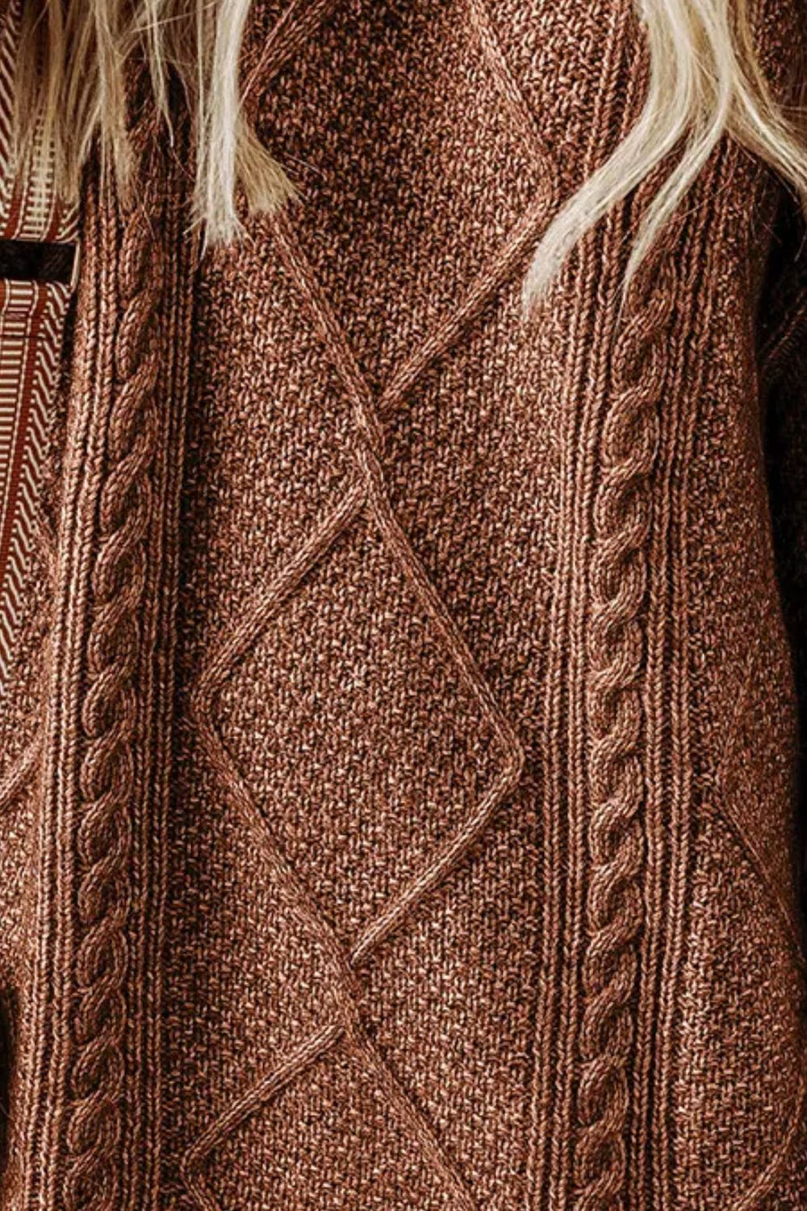 Brown cable knit sweater dress with diamond pattern and braided details.