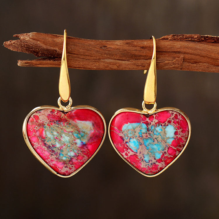 Heart-shaped jasper and gold earrings with red and sky blue stone details.