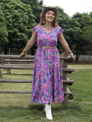 Vibrant floral tiered maxi dress with cap sleeves and cinched waist.