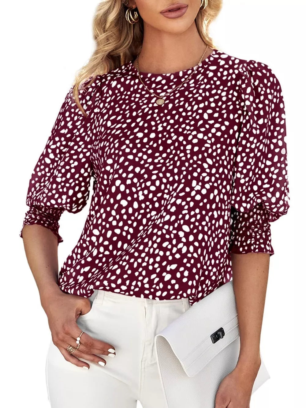 Burgundy animal print blouse with half sleeves and ruched cuffs.