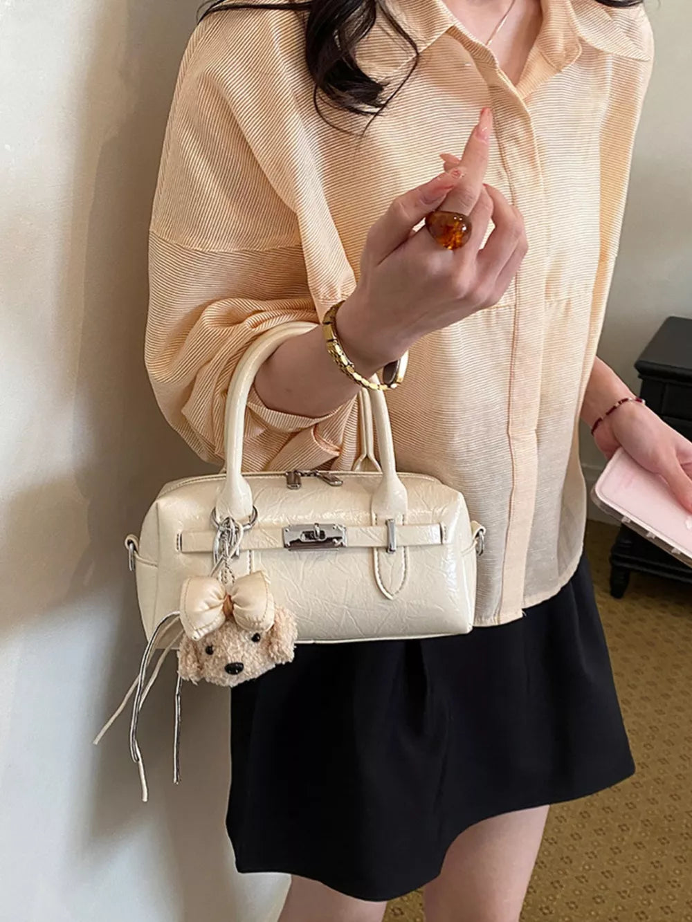handbag in cream with geometric and top handle