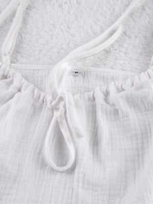 White cotton cami pajama top with adjustable tie detail and spaghetti straps