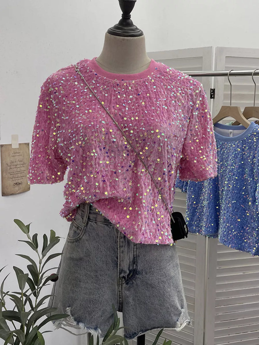 Pink crew neck t-shirt with iridescent sequin embellishments and short sleeves.