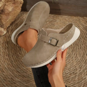 Khaki buckle accent round-toe slip-on flats with contrast stitching.