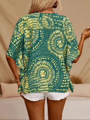 Green bohemian print v-neck t-shirt with short sleeves and a relaxed fit.