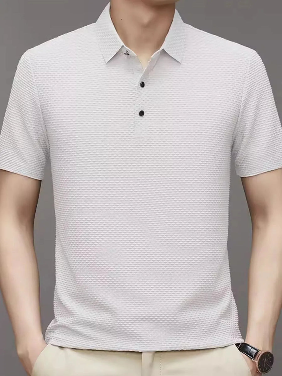 White textured knit polo shirt with a classic collar and two-button placket.