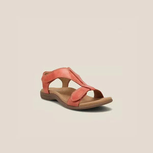 Tangerine leather T-strap comfort sandals with adjustable straps and cushioned footbed.