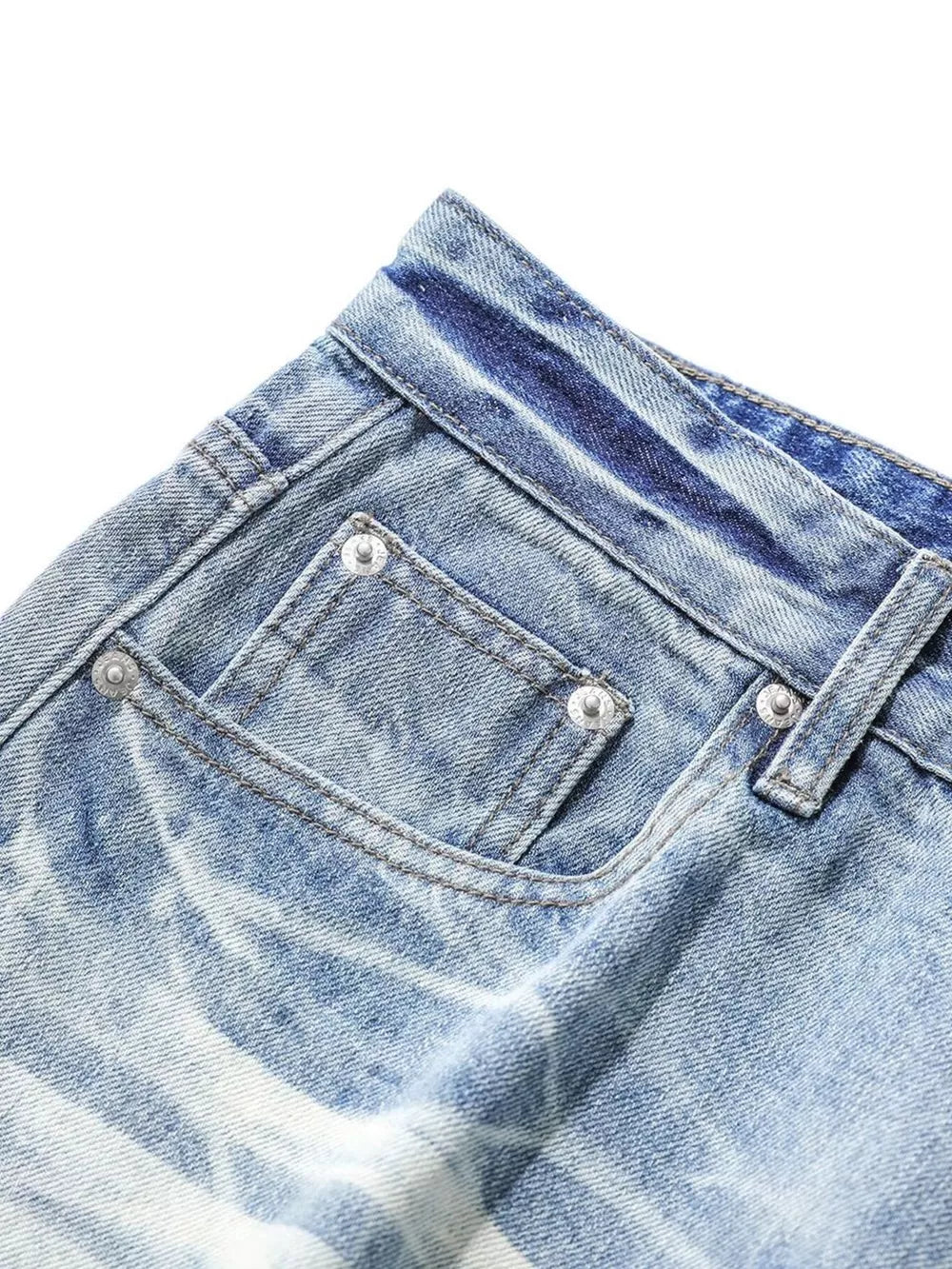 Light blue relaxed fit denim capris with pocket detail and distressed wash.