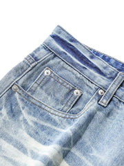 Light blue relaxed fit denim capris with pocket detail and distressed wash.