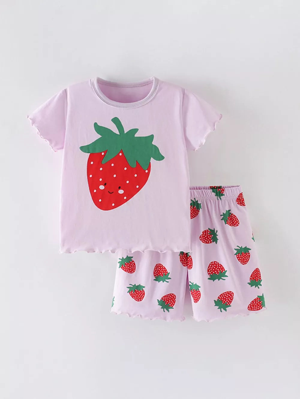 Girls' pink cotton pajama set with strawberry graphic and allover strawberry print.