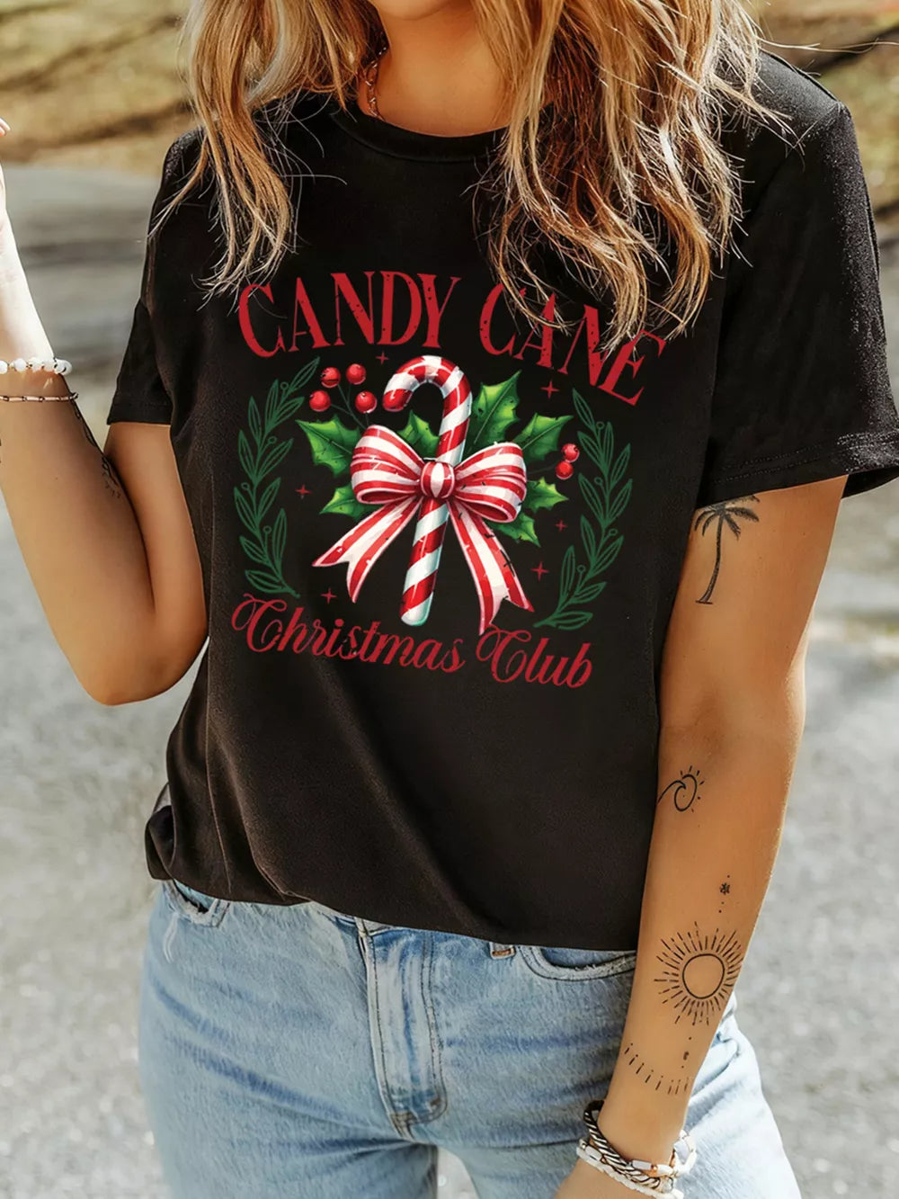 Black cotton t-shirt with festive candy cane and holly graphic, short sleeves, crew neck.