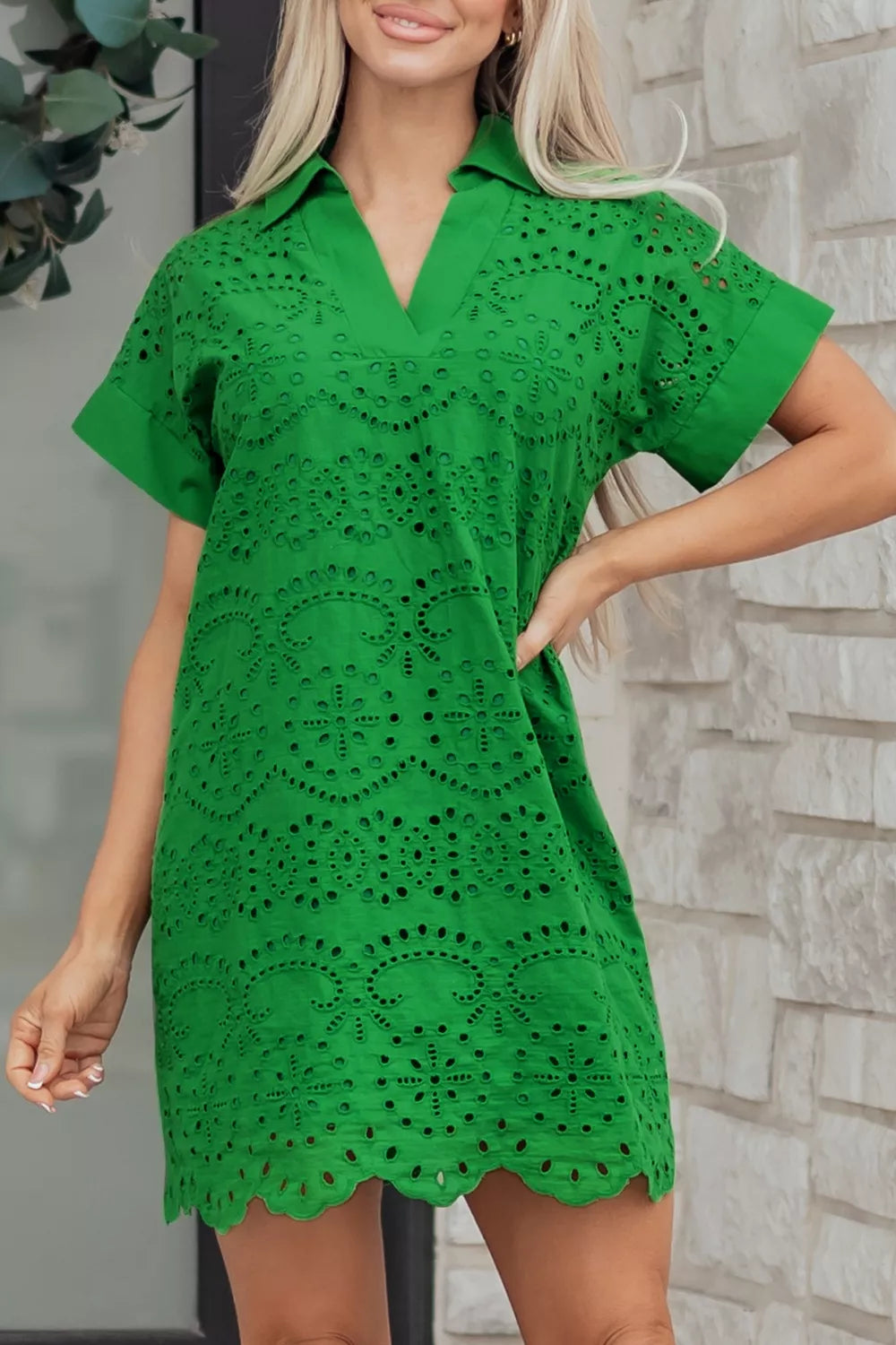 Green cotton eyelet collared dress with short sleeves and scalloped hem.