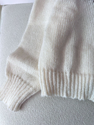 dark brown pullover sweater with ribbed cuffs and long sleeve