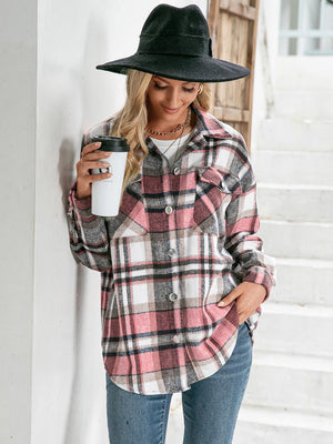 Oversized pink plaid flannel shacket with patch pockets and buttoned front.