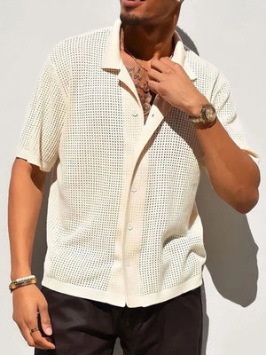 Ivory perforated knit resort shirt with short sleeves and a button-up collar.