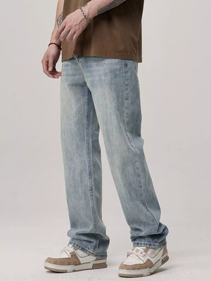 Men's light blue relaxed fit wash jeans with a casual, everyday style.