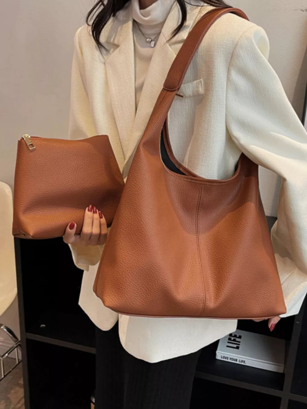 Brown pebbled leather hobo shoulder bag with matching zip pouch.