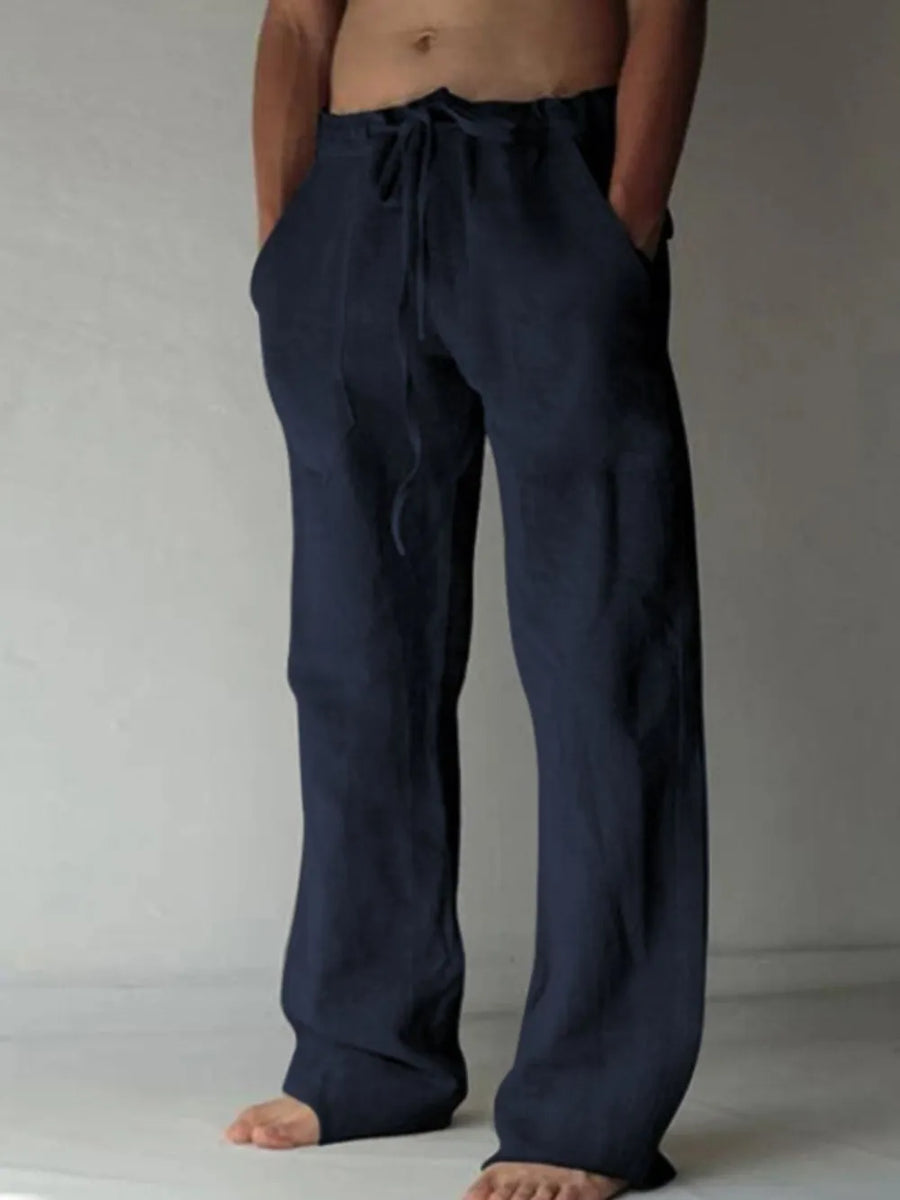 Navy linen blend wide-leg drawstring trousers with pockets.