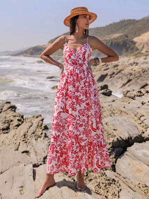 Red floral faux-wrap midi dress with spaghetti straps and tiered hem.