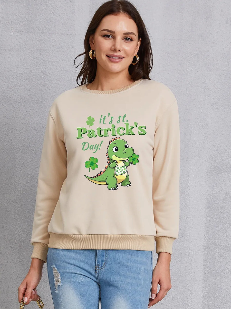Khaki St. Patrick's Day sweatshirt with cartoon dinosaur graphic and shamrocks.