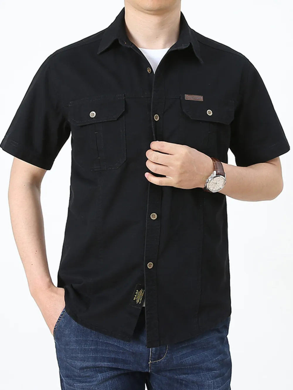 Men's black short sleeve cotton shirt with two chest pockets and button-down collar.