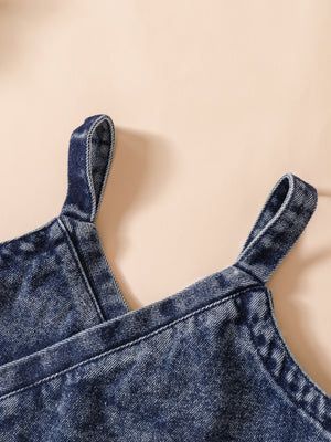 Acid-wash denim cami with adjustable straps.