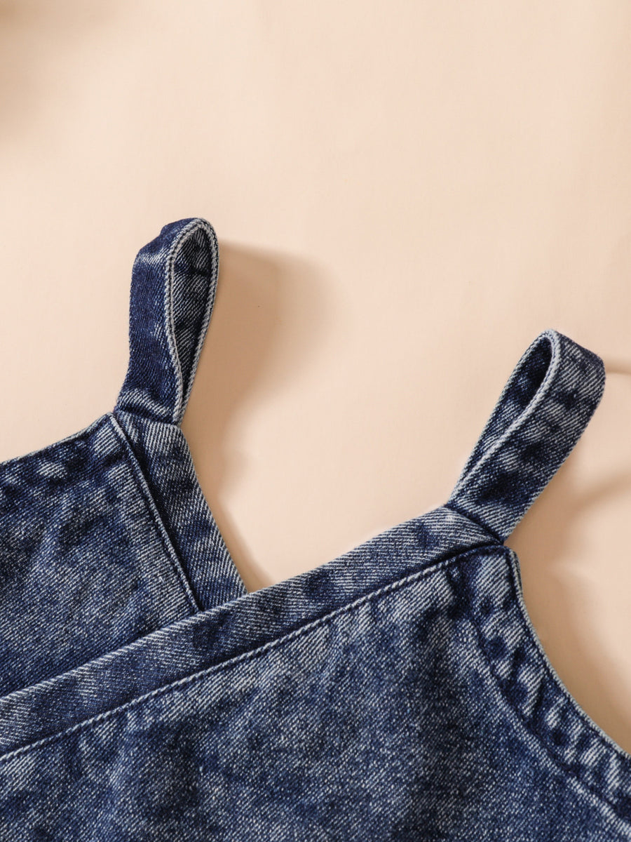Acid-wash denim cami with adjustable straps.