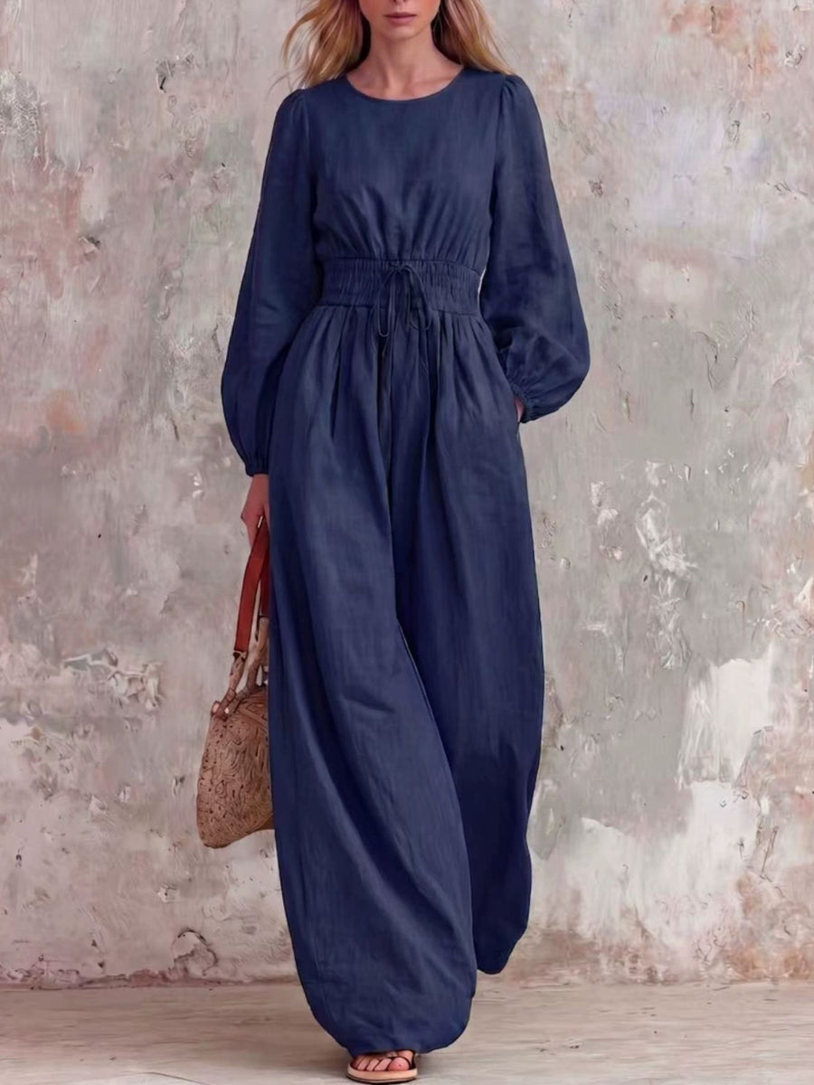 jumpsuit in navy blue featuring pocketed and relaxed fit