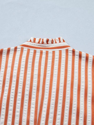 Striped orange and white mini dress with ruffled neckline detail