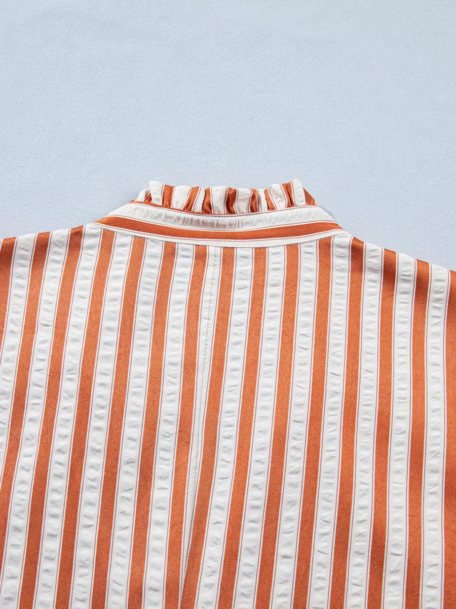 Striped orange and white mini dress with ruffled neckline detail