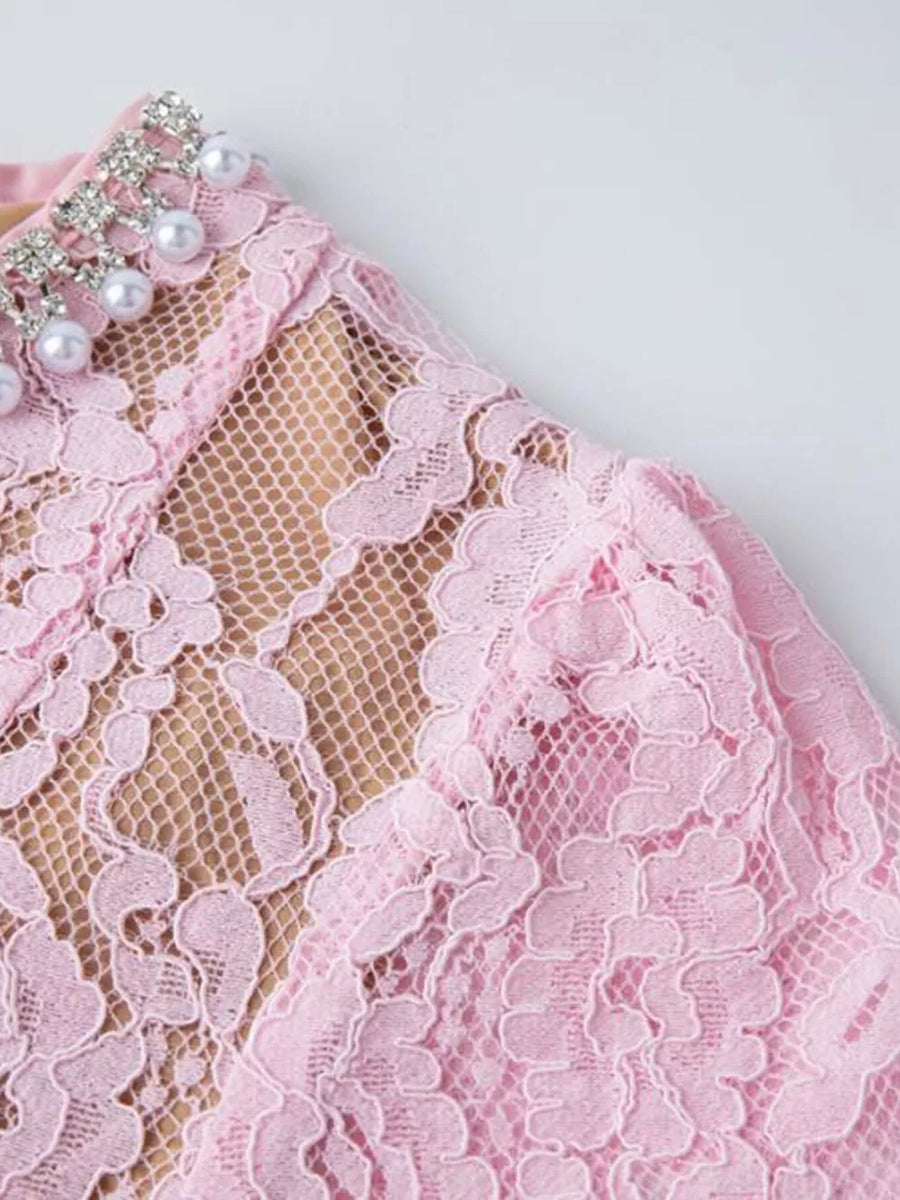 Pink lace dress with pearl and rhinestone embellished collar detail.