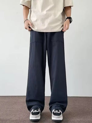 Navy blue casual wide-leg cargo pants with front pockets for men.