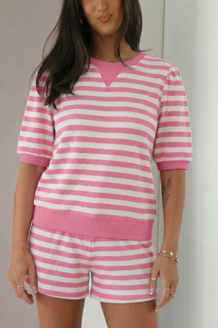 Puffed sleeve striped two-piece set in strawberry pink and white, with a crew neck top and drawstring shorts.