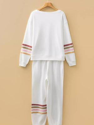 White loungewear set with striped sleeve and pant details