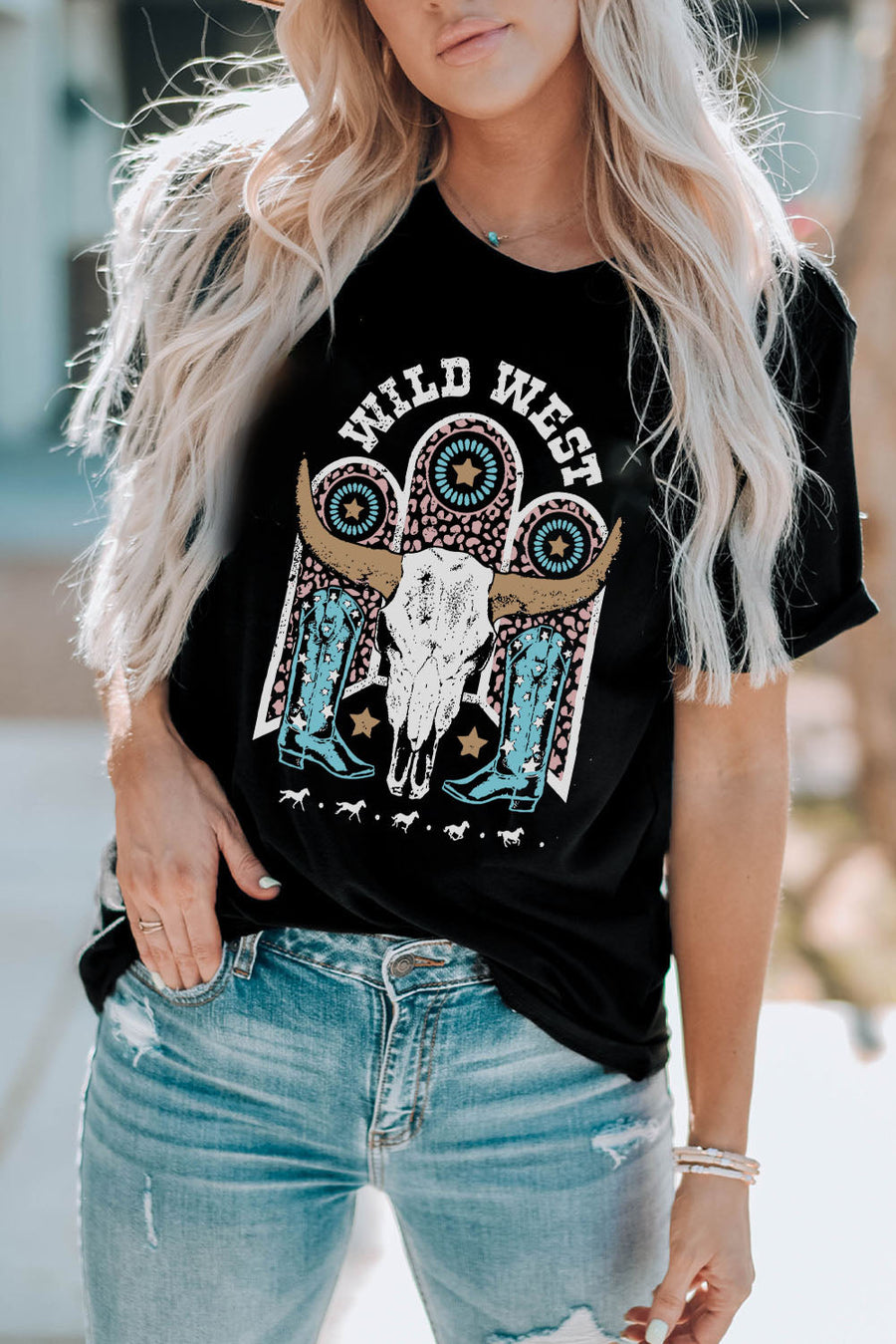 Black crewneck tee with Wild West graphic featuring bull skull and cowboy boots.