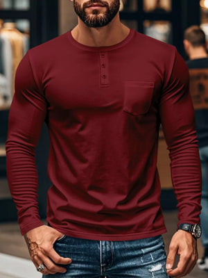 Maroon long sleeve henley t-shirt with button placket and chest pocket.