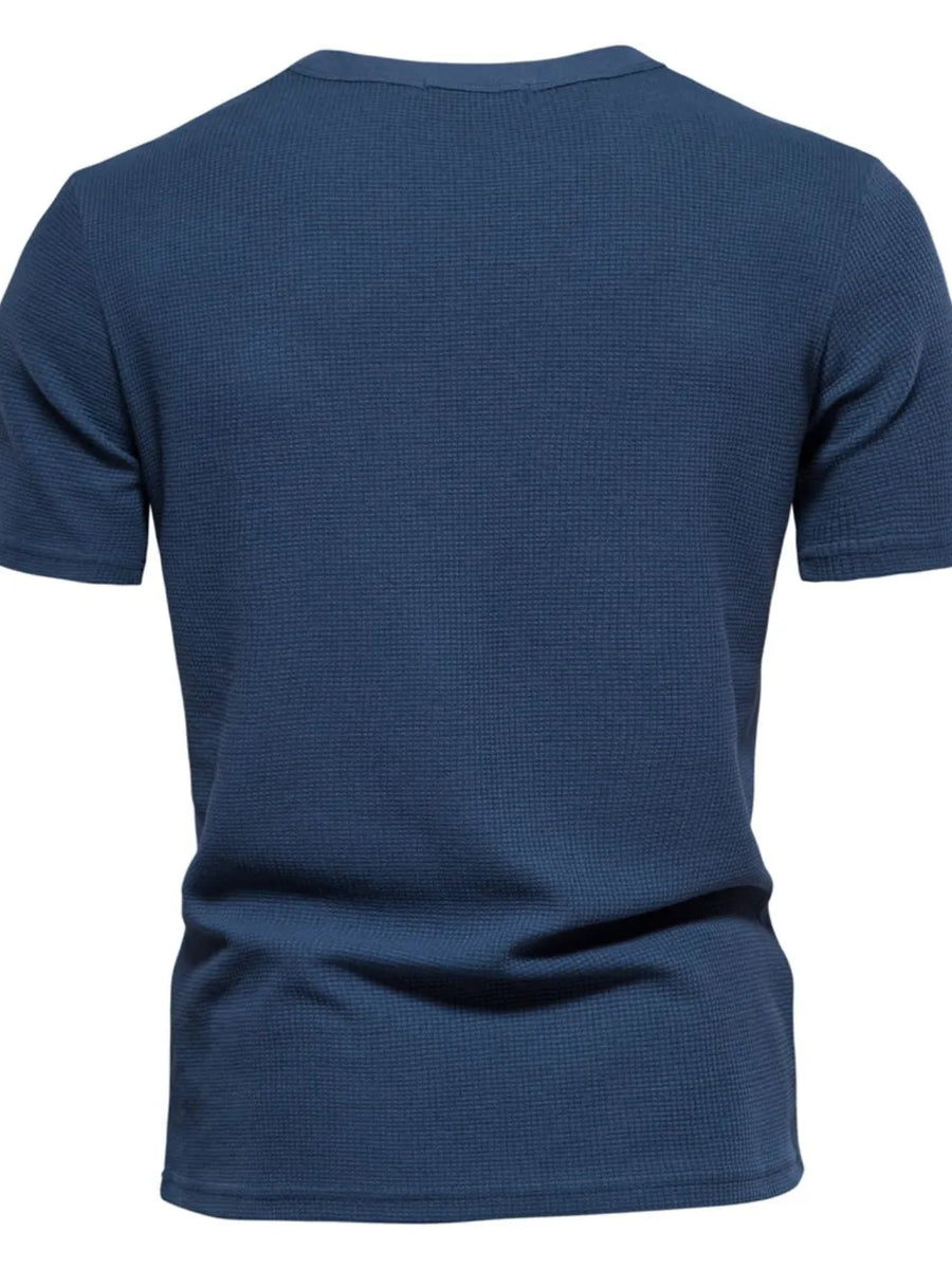 Navy textured crew-neck t-shirt knit with short sleeves.