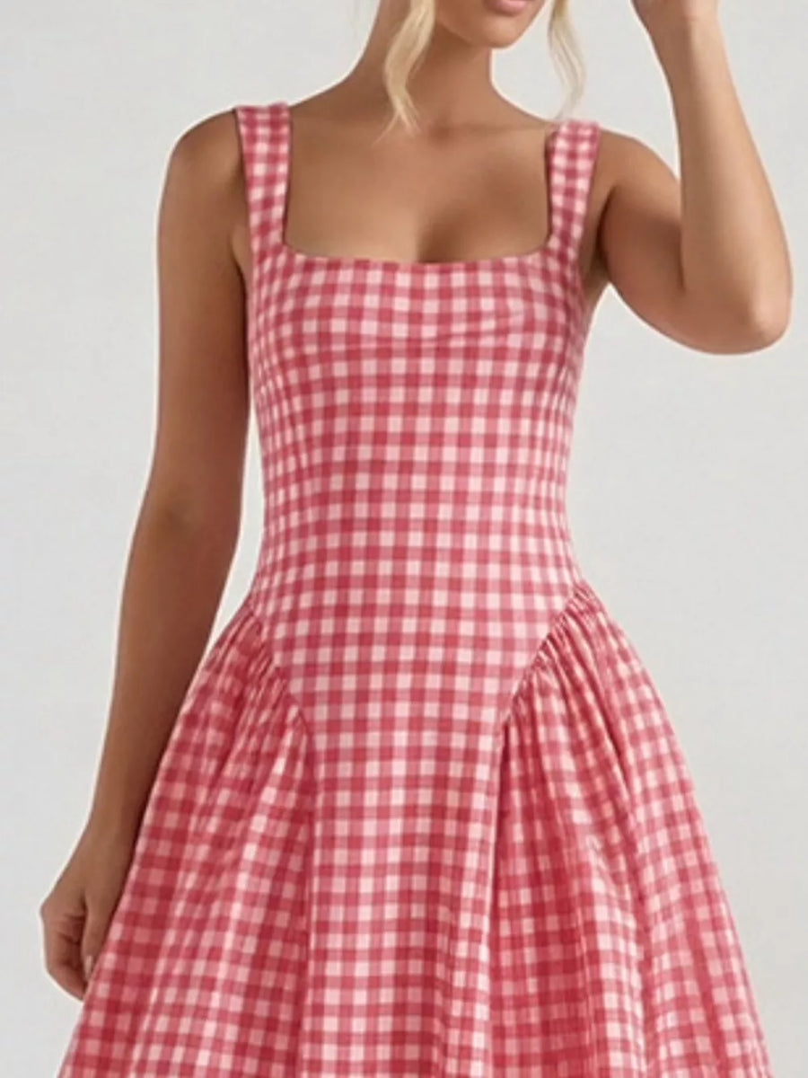 Plaid square neck midi dress in blush pink with a-line skirt and wide straps.