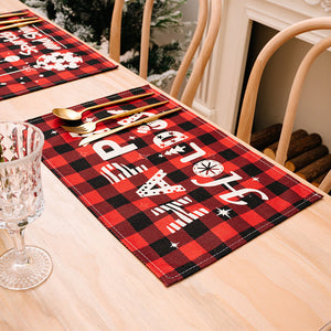 Festive plaid placemat with white text reading Happy Holidays and Christmas icons.