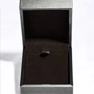 Empty jewelry box with dark velvet lining and clasp.